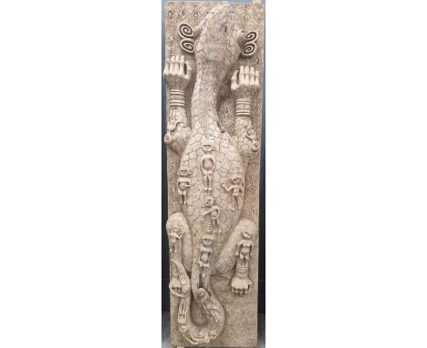 A Timorean wooden door carved in high relief with a lizard bearing human figures while reclining on an ammonite scroll back g