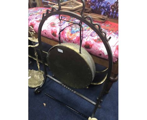 BRASS PIERCED FENDERalong with a brass gong, a brass stick stand and a carved chair (4)