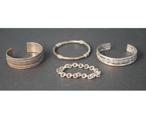 Four silver bracelets, including two silver cuff bangles with plaited rope design, a Chinese design bangle and an oval link D