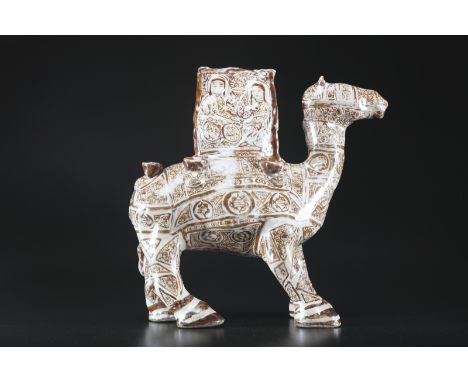ARTE ISLAMICA . A massive Kashan lustre painted pottery in the shape of a camel carrying a palanquin Iran, Kashan, late 12th 