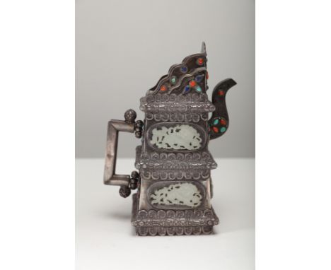Arte Cinese . A silver teapot decorated with jade plaques and encrusted with coral,  turquoise, and lapislazuli China, Qing d
