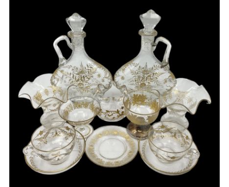 Collection of eleven pieces of French gilded glassware comprising pair of flattened lozenge form decanters with stoppers, pai