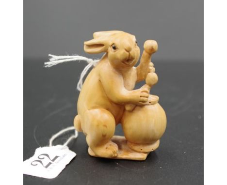 Japanese carved wood drummer rabbit netsuke signature to base, 6cm height approx.
