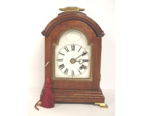 Miniature mahogany bracket clock with brass feet and fittings. 8 day fusee movement. 19cm high (not including the handle)