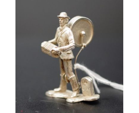 Silver musician miniature figure standing musician with accordion and drum, (height 5.5cm approx).