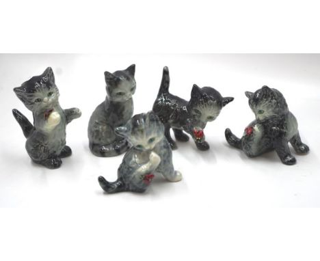Five various Goebel grey kitten figurines including 4 with lady birds and one standing kitten