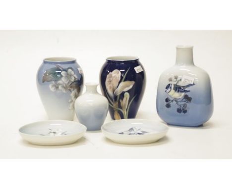 Seven Royal Copenhagen table wares comprising four various floral, bird and butterfly decorated vases, a 1976 Christmas plate