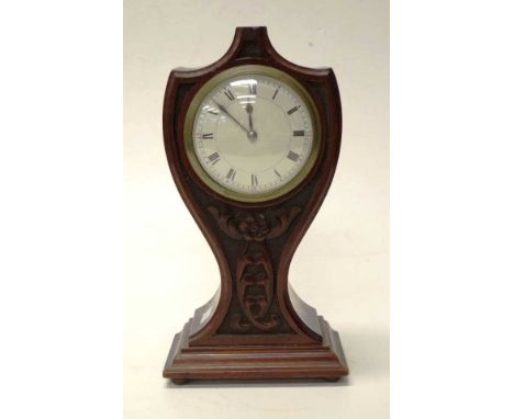 Antique English wood cased mantle clock in waisted carved wood case, key unavailable, untested, (height 25cm approx).