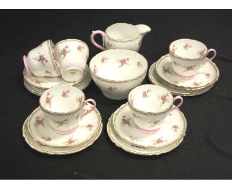 Shelley blossom decorated part tea set including: 5 teacups and saucers, 6 side plates, a cream jug, and a sugar bowl.