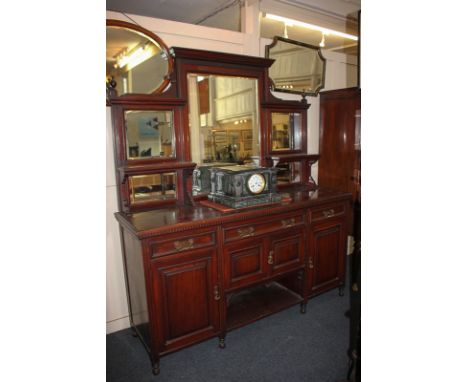 A Victorian mahogany sideboard, the raised back with mirror panels and two shelves, on base with three drawers, cupboards and