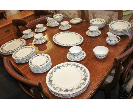 A Royal Doulton 'Burgundy' part tea and dinner service comprising serving platter, gravy boat and saucer, eight soup plates, 