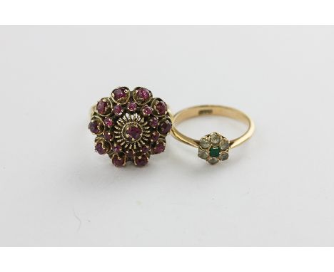 An emerald and old cut diamond cluster ring in 18ct gold, a ruby cluster ring set with two rows of circular cut stones