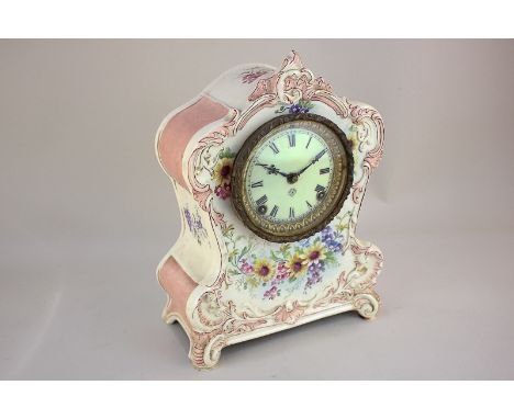 An Ansonia mantel clock in Royal Bonn ceramic case, with scroll borders and floral decoration, marked La Clair, 32cm high
