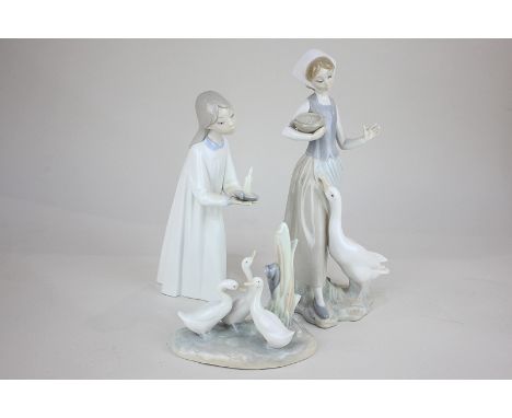 Two Lladro porcelain figures of girls, one in a nightdress, the other feeding a goose, 25cm and a Nao group of three geese 12