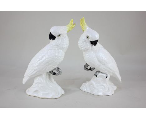 A pair of Crown Staffordshire bone china white cockatoos by J T Jones, further signed by W R Tipton, 25cm high