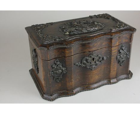 An oak tea caddy with foliate metal mounts, the top with plaque of a pheasant amongst trees, 28.5cm (a/f lacks interior fitti