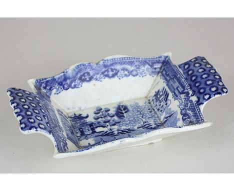 An early 19th century blue and white porcelain pickle dish, rectangular shape with two handles, with transfer print of a pago