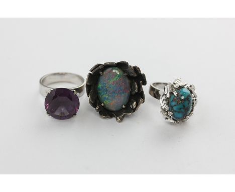 An amethyst dress ring in 14ct white gold, black opal doublet ring, a turquoise matrix ring in 14ct white gold