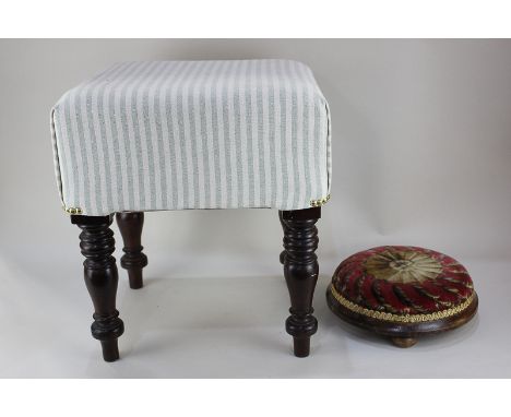 A circular upholstered footstool on three button feet, 30cm, and a square stool with blue striped upholstery