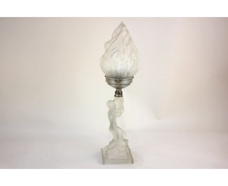 An Art Deco style frosted glass figural table lamp of a nude holding aloft a light, kneeling on rectangular base (a/f), 46cm 