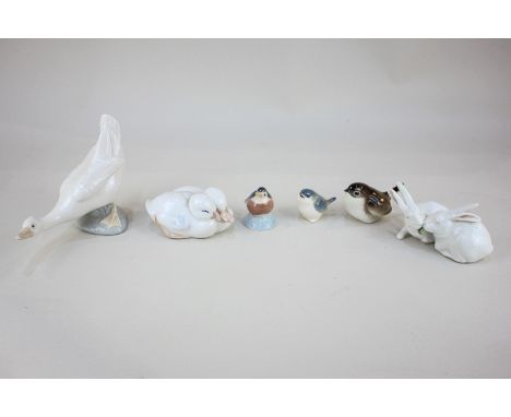 Three Royal Copenhagen porcelain figurines comprising a pair of ducks 516, a pair of rabbits 518, and a baby robin 2238, toge