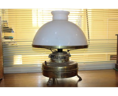 A brass oil lamp converted to a table lamp, HS Calorifix No 60, with white glass shade, presentation plaque from the NATO Sac