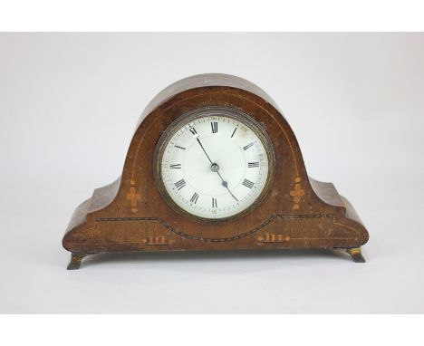 An Edwardian mantel clock in dome shaped inlaid mahogany case, on brass feet, 25cm