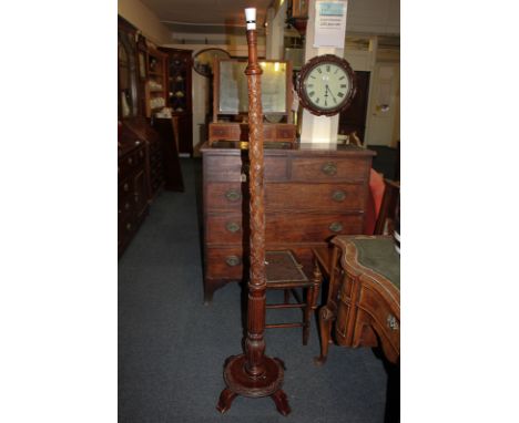 A 20th century carved wood standard lamp, with lattice and leaf decoration, 168cm high