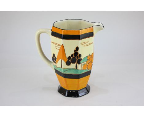 A Clarice Cliff Fantasque pottery jug of octagonal form, depicting trees in a landscape, marked Wilkinson Ltd, 18cm high