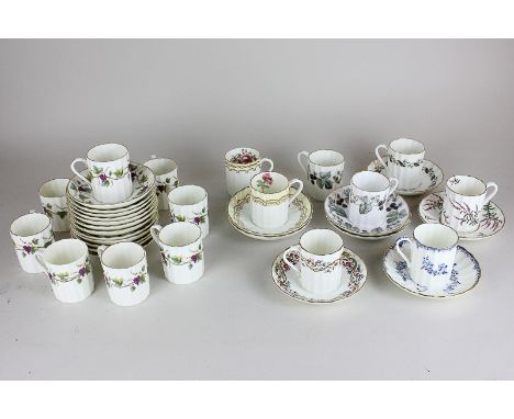 A set of eight Royal Worcester Bacchanal pattern coffee cans and ten saucers, together with eight other Royal Worcester coffe