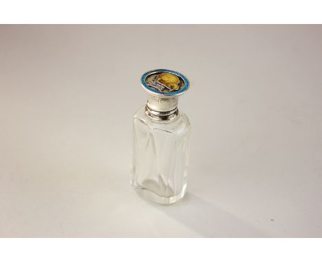 A George V silver and enamel scent bottle with stopper, the lid decorated with a yellow chick within a blue border, London 19