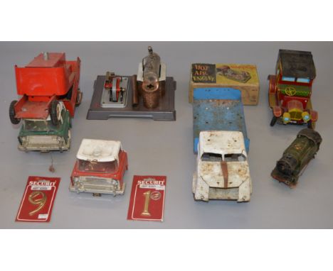 A mixed lot of unboxed playworn toys including three Tri-ang pressed steel lorries, a tinplate battery operated car and a liv