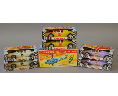Six Marx plastic Racing Cars with friction drive together with a battery operated remote control Helicopter, also by Marx, al