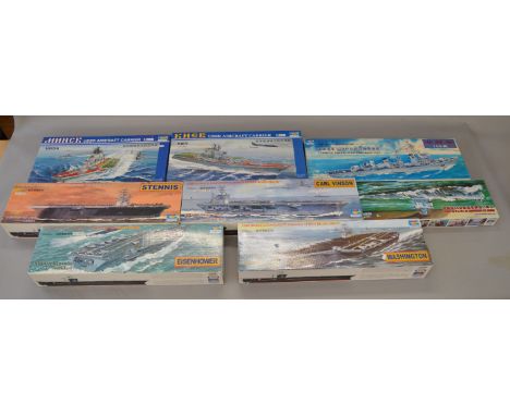 Eight boxed Trumpeter ship and submarine model kits in various different scales including 'Eisenhower', 'Washington' and 'Car