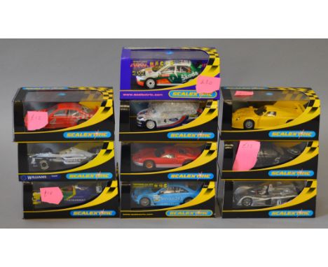 Ten boxed Scalextric slot cars including C2258 Cadillac LMP and C2424 Ford GT40 Mk II.  Overall models appear VG in  boxes ra
