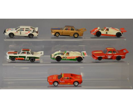 Seven unboxed Scalextric slot cars with 'yellowing'  to some of the white cars and one has missing and broken drive belts, ot