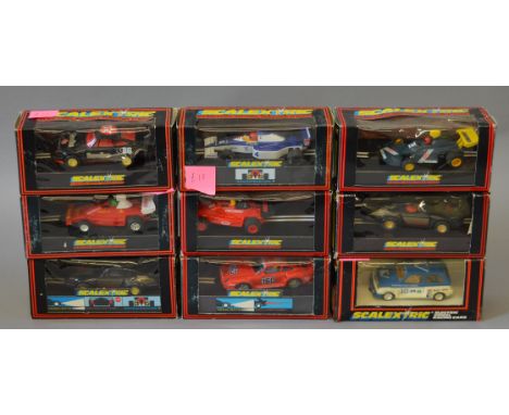 Nine boxed Scalextric slot cars including C467 Tyrrell 018 and a C124 Havoline Porsche 911.  Overall models appear G/G+ in ge