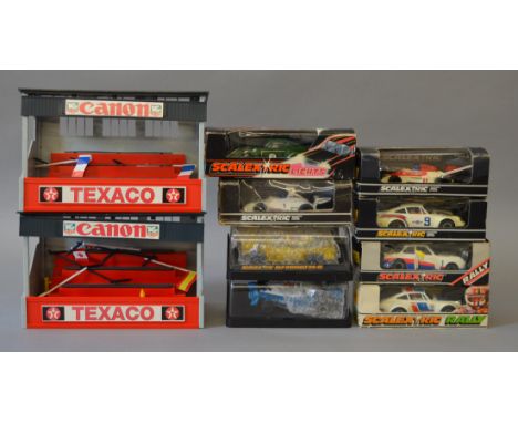 Seven boxed Scalextric slot cars including C115 Porsche Turbo 935 and a C134 Elf Renault RS-01 together with two unboxed Spec