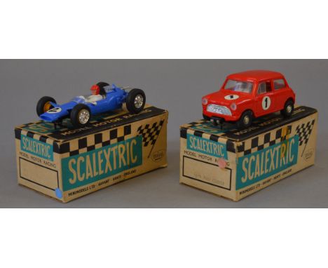 Two boxed Scalextric slot cars, C76 Mini Cooper and C82 Lotus, both appear G in F/G boxes (2)