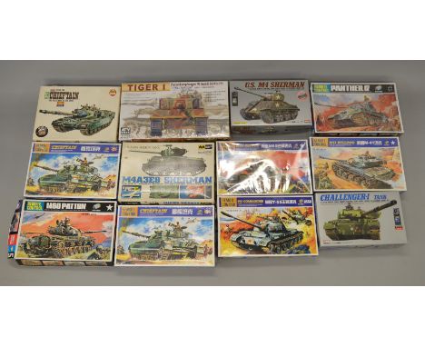 12 x Assorted military model kits, various scales & manufacturers, includes motorised kits. Viewing recommended.