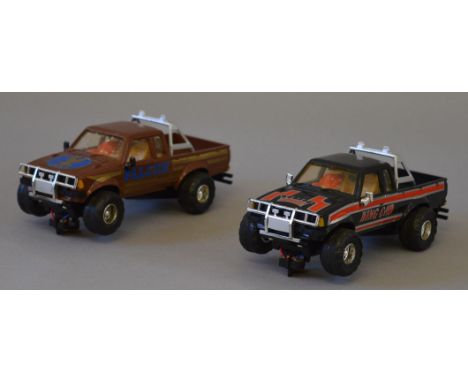 Two unboxed Scalextric Datsun King Cab slot cars, overall appear G. (2)