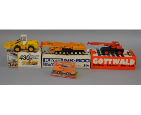 Four boxed diecast model Crane Vehicles, a Conrad Guttwald AMK 46-21 and an NZG JCB 430 Articulated Loader, both in 1:50 scal