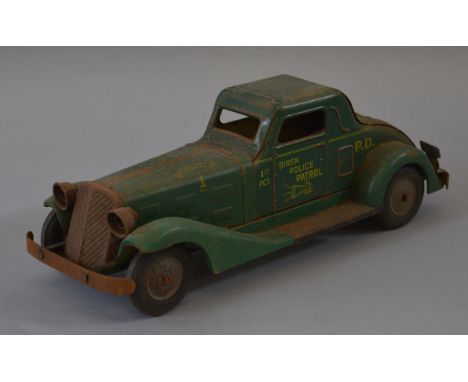 A scarce  unboxed  Marx tinplate Police Patrol Car with Siren, made in USA, fitted with a clockwork drive mechanism and batte