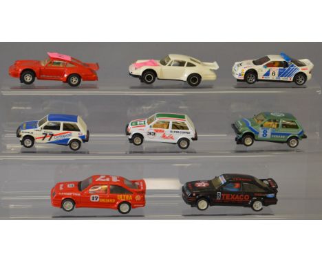 Eight unboxed Scalextric slot cars with 'yellowing'  to some of the white cars, otherwise appear F/G together with a Metro mo