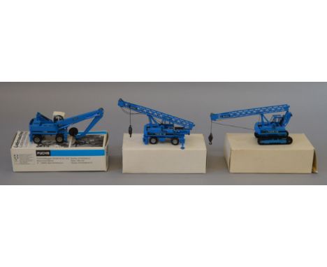 Three boxed 1:50 scale diecast model Fuchs Crane Vehicles, a Conrad Scrap Handler together with a Fuchs 118 Crane and a Hydra