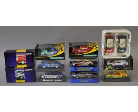 Eleven boxed Scalextric slot cars including C3116 Mercedes SLR McLaren 722GT,  a C2486A Skoda Fabia WRC and a partly boxed se