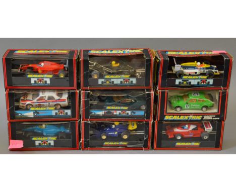 Nine boxed Scalextric slot cars including C375 Palmer Tube Mills XR3i and a C572 Alfa Romeo 155 'Racing'.  Overall models app