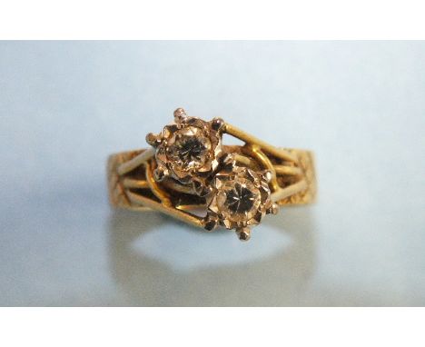 An 18ct yellow gold cross-over ring illusion-set two brilliant-cut diamonds, size P, 6.9g.