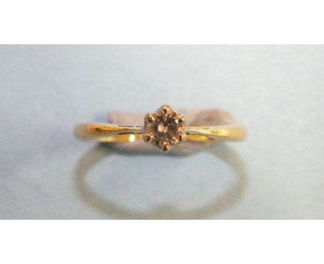 A solitaire diamond ring claw-set a brilliant-cut diamond of approximately 0.2cts, in 18ct yellow gold mount, size N, 2.3g.