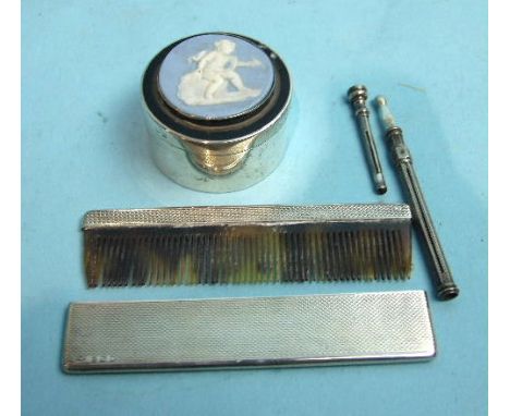 An engine turned silver cased tortoiseshell comb, 10cm long, London, 1938 a small circular pill box with blue jasperware lid 